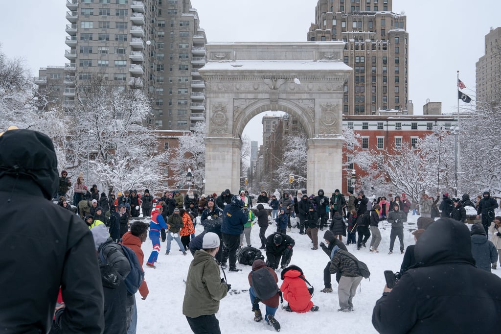 People gather in New York’s Washington Square Park for a mass snowball fight on Monday. Photo: TNS