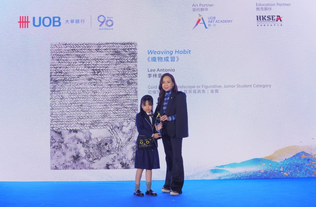 Marietta Li (right), director of the UOB Art Academy, presents an award to a student winner at the 2025 UOB Art in Ink Awards ceremony. Photo: UOB