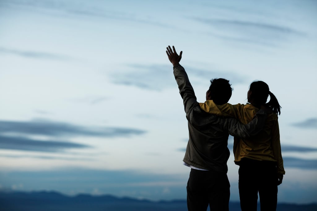 A couple bond on a mountainside. The new naming trend stresses practicality over romance. Photo: Getty Images
