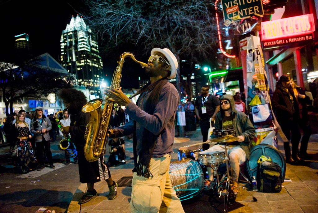 A saxophonist performs on the street during South by Southwest in Austin, Texas, in 2015. Photo: EPA A saxophonist performs on the street during South by Southwest in Austin, Texas, in 2015. Photo: EPA