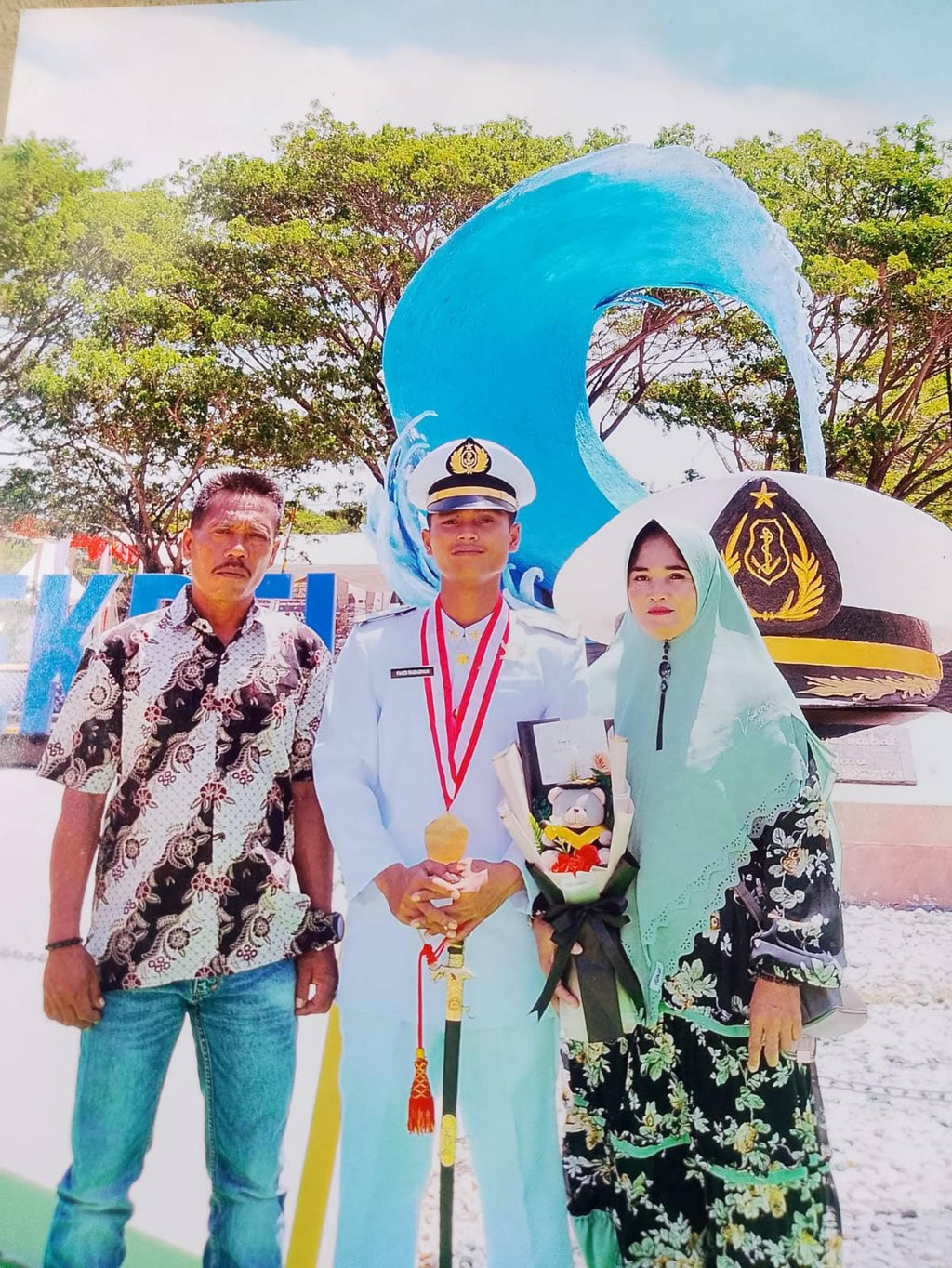 Fandi Ramadhan with his parents, Sulaiman (left) and Nirwana (right), in a family photograph taken before his arrest. Photo: Handout