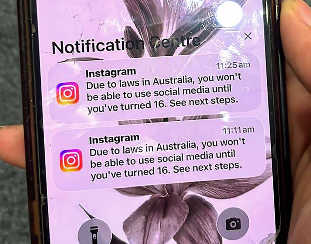 A teenager holds a mobile phone displaying a message from Instagram after the account was locked for age verification in Sydney on December 9, 2025. Photo: AFP A teenager holds a mobile phone displaying a message from Instagram after the account was locked for age verification in Sydney on December 9, 2025. Photo: AFP