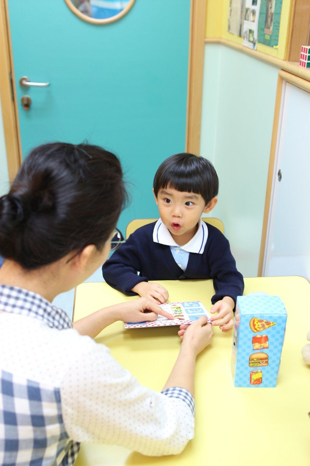 A student at the Bradbury Child Care Centre in a one-on-one lesson. Photo: Handout A student at the Bradbury Child Care Centre in a one-on-one lesson. Photo: Handout