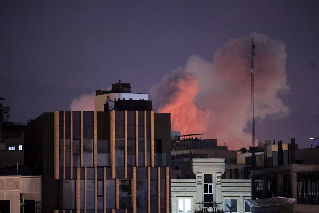 Smoke rises behind buildings after an explosion on the second consecutive day of strikes by the US and Israel, in Tehran, Iran. Photo: EPA Smoke rises behind buildings after an explosion on the second consecutive day of strikes by the US and Israel, in Tehran, Iran. Photo: EPA