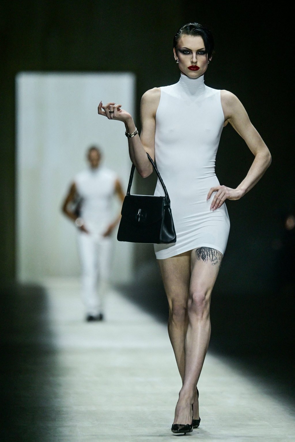 The Gucci show opened with this body-con dress. Photo: Reuters The Gucci show opened with this body-con dress. Photo: Reuters