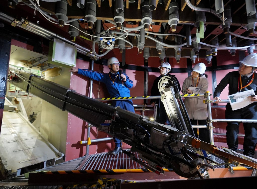 A robotic arm shows the removal of melted nuclear fuel debris during a simulation at the Fukushima Daiichi nuclear power plant on Wednesday. Photo: Kiki Press/AFP