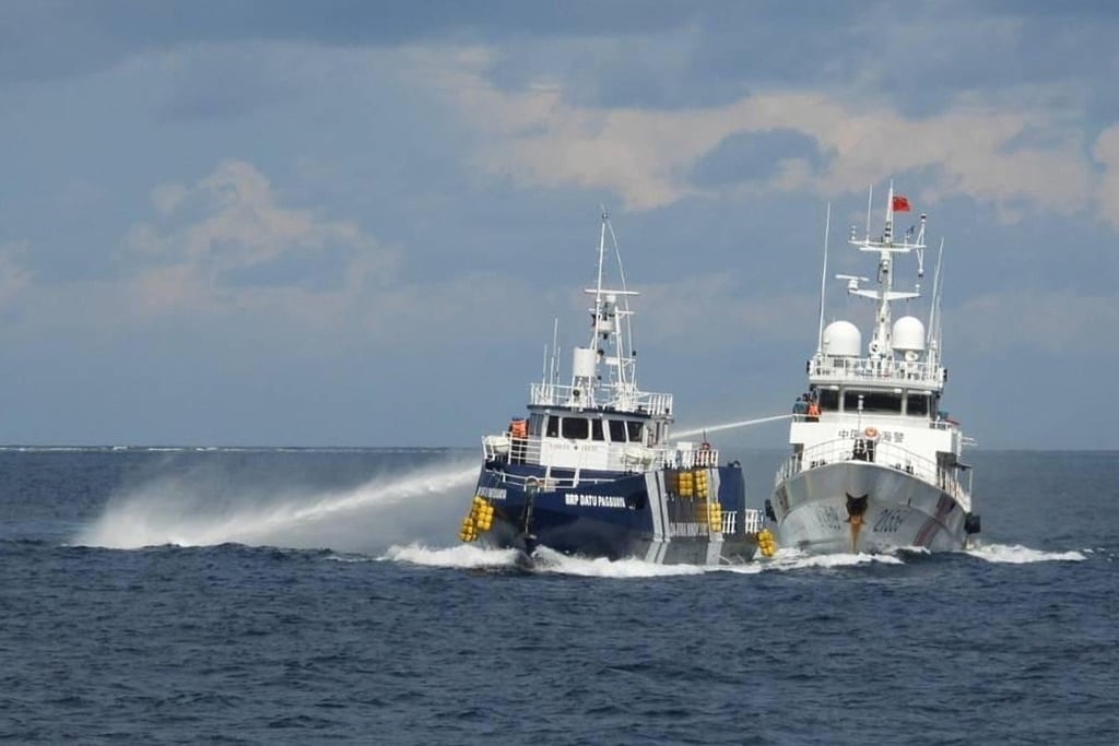 A Chinese coastguard vessel (right) fires its water cannon at the Philippines’ BRP Datu Pagbuaya in the disputed South China Sea in October 2025. Photo: Philippine Coast Guard via AP