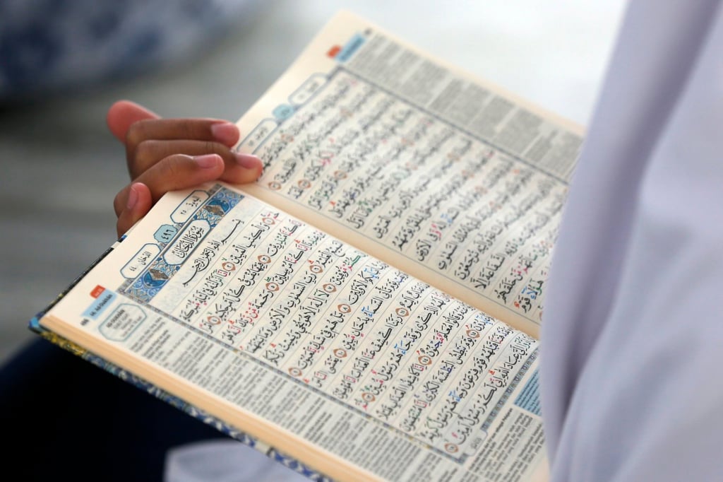 A pupil learns to read Arabic last month during a Koran memorisation lesson in Indonesia. Photo: EPA A pupil learns to read Arabic last month during a Koran memorisation lesson in Indonesia. Photo: EPA