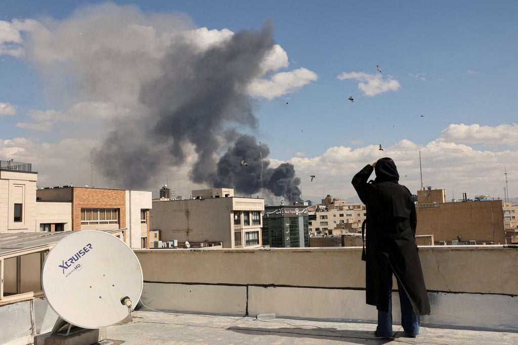 Smoke rises following an explosion in Tehran on Sunday. Photo: Reuters