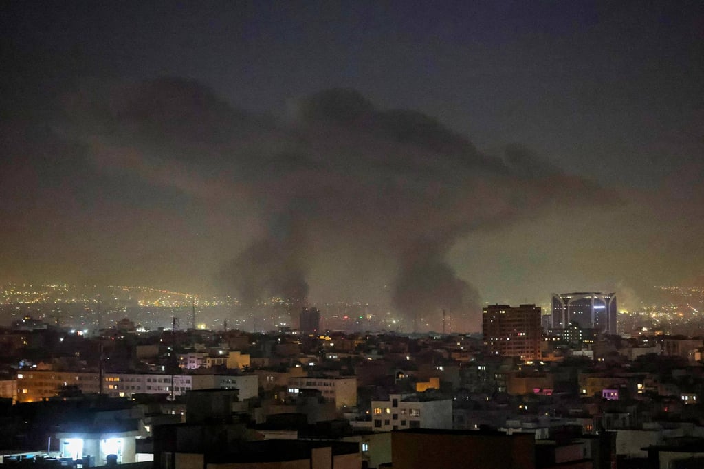 Plumes of smoke rise following reported explosions in Tehran early on Tuesday. Photo: AFP