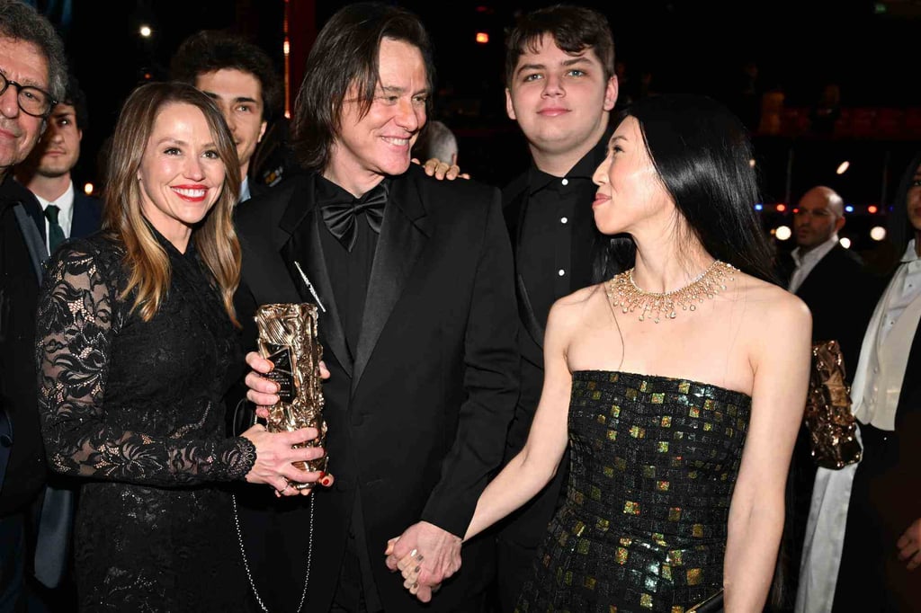 Jim Carrey holding hands with his partner, Min Ah, alongside his daughter Jane (left) and her son, Jackson (second from right). Photo: @JimCarreyOnline/X