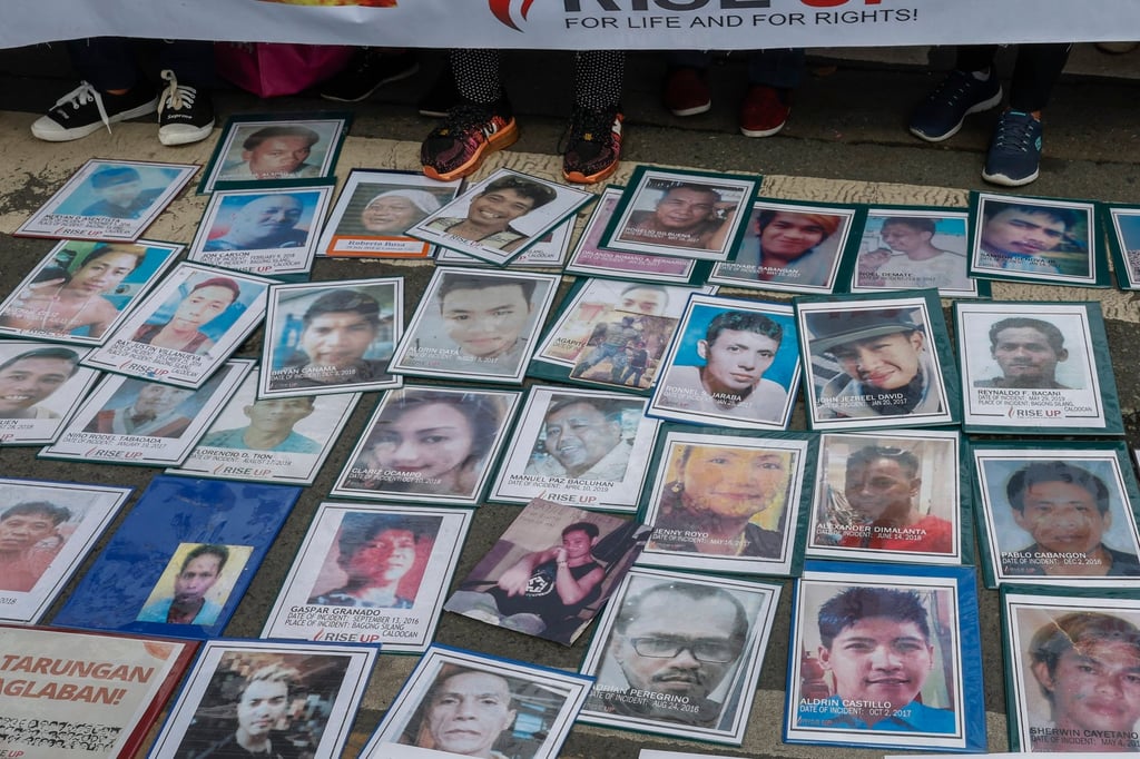 Images of victims of alleged extrajudicial killings during the term of former Philippine president Rodrigo Duterte are laid out during a rally in Quezon City in November 2024. Photo: EPA-EFE