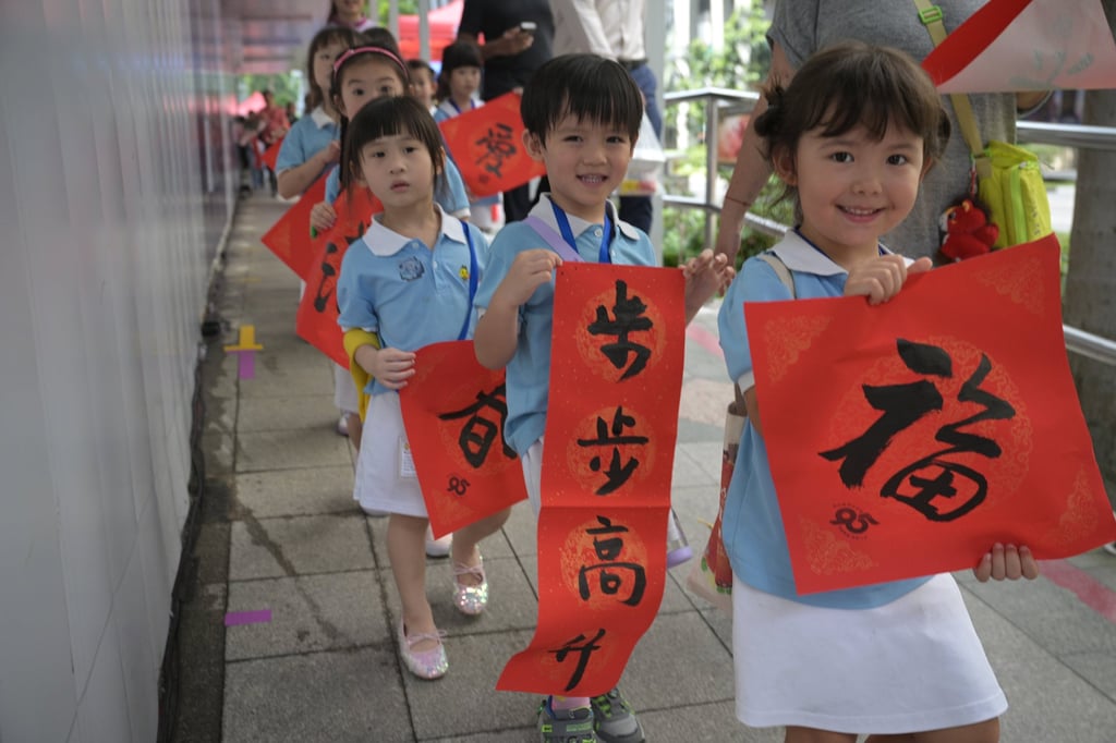 Children show calligraphy works they have received as part of Chinese New Year celebrations, in Singapore on January 29. Singapore’s total fertility rate plunged to a record low of 0.87 in 2025. Photo: Xinhua Children show calligraphy works they have received as part of Chinese New Year celebrations, in Singapore on January 29. Singapore’s total fertility rate plunged to a record low of 0.87 in 2025. Photo: Xinhua