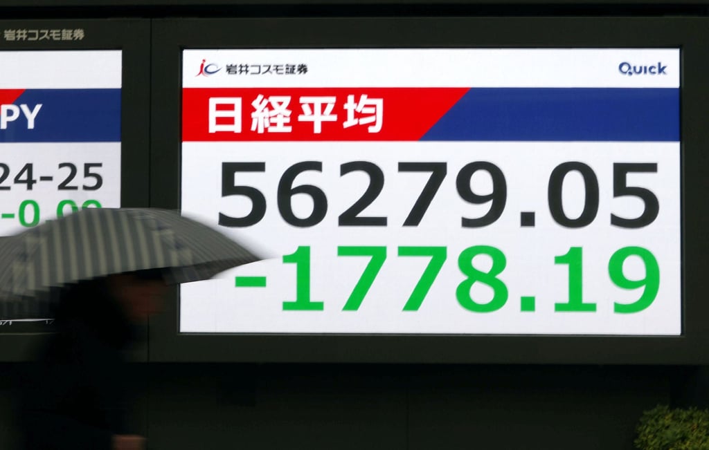 A monitor in Tokyo shows the Nikkei stock index. Photo: Kyodo