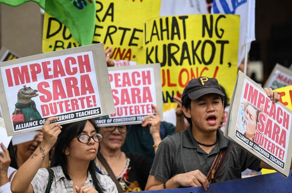 Protesters call for the impeachment of Vice-President Sara Duterte-Carpio outside the House of Representatives in Quezon City on Monday. Photo: AFP Protesters call for the impeachment of Vice-President Sara Duterte-Carpio outside the House of Representatives in Quezon City on Monday. Photo: AFP