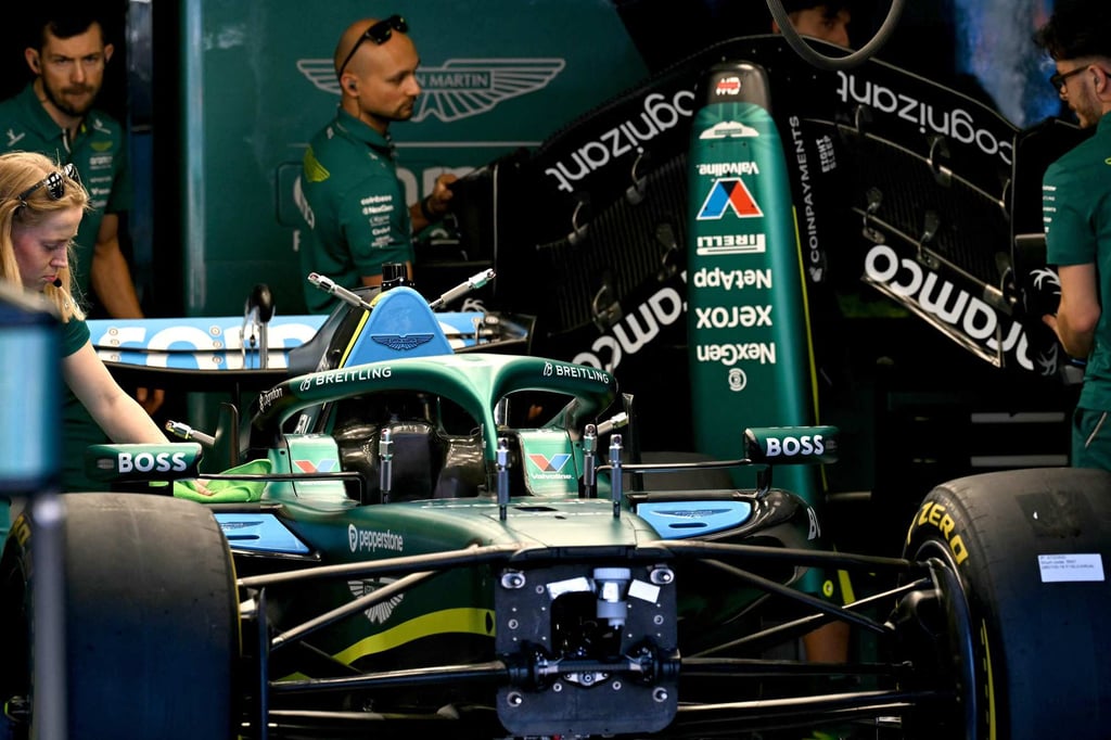 Mechanics work on the car of Aston Martin’s Lance Stroll. Photo: AFP