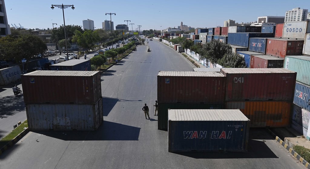 Containers are placed for added security on a road leading to the US consulate in Karachi, Pakistan, on Wednesday. Photo: EPA