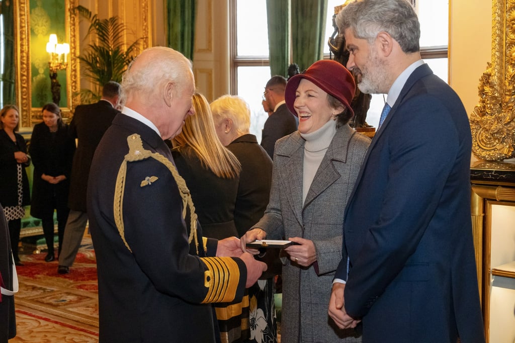 Britain’s King Charles presents an Elizabeth Emblem award to Houng for Becky during the inaugural presentation ceremony at Windsor Castle in December 2024. Photo: Getty Images
