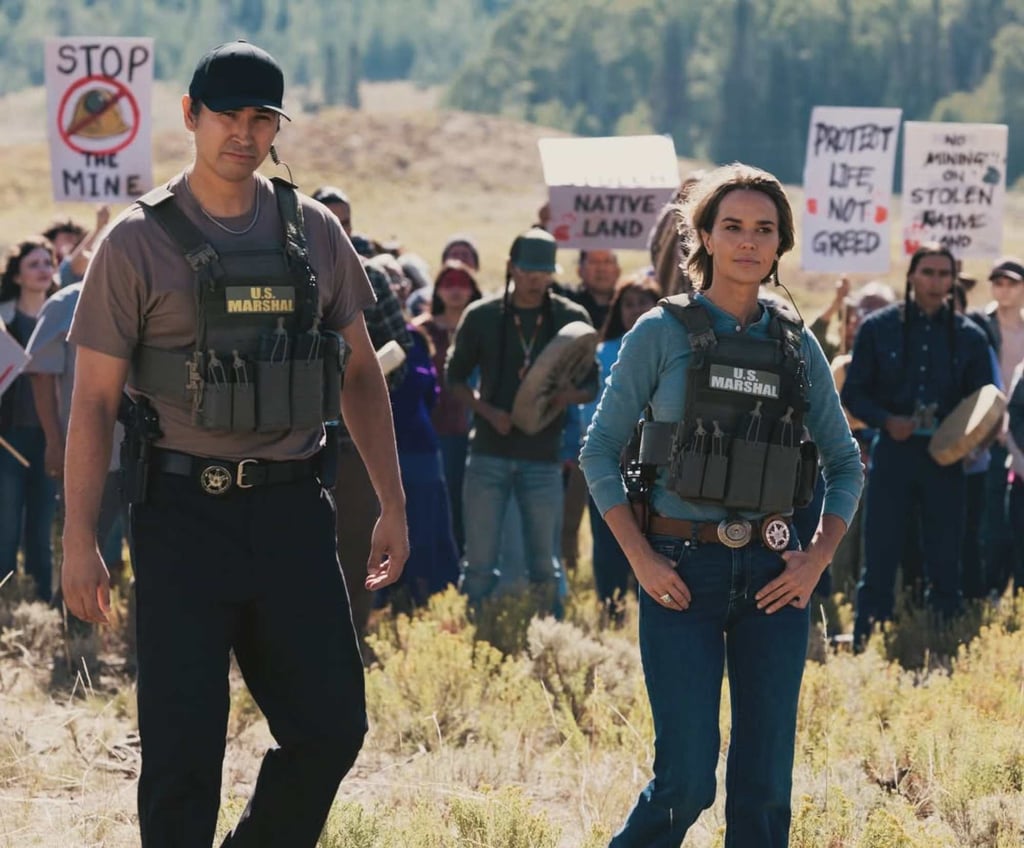 Arielle Kebbel’s character, Belle Skinner (right), is a former federal undercover operative whose carefully guarded secrets make her the most enigmatic member of the team on Marshals. Photo: @ariellekebbel/Instagram