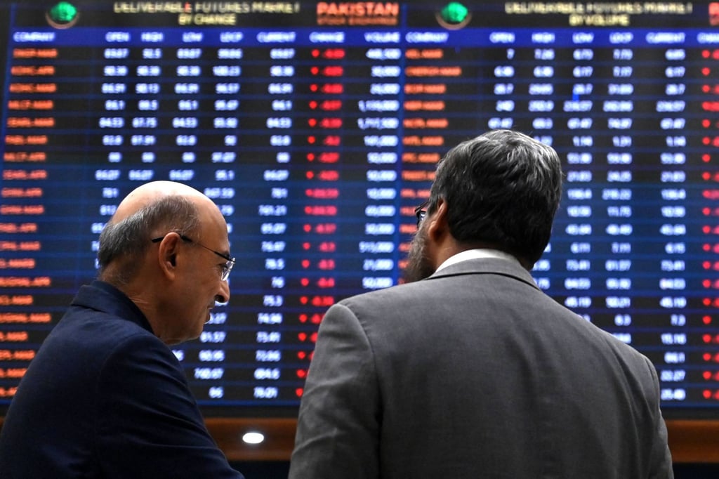 Stockbrokers monitor share prices at the Pakistan Stock Exchange in Karachi on Monday. Photo: AFP