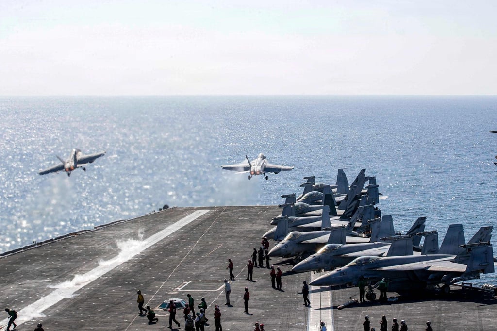 Two F/A-18 Super Hornets launch from the USS Abraham Lincoln. Photo: US Navy via AFP Two F/A-18 Super Hornets launch from the USS Abraham Lincoln. Photo: US Navy via AFP