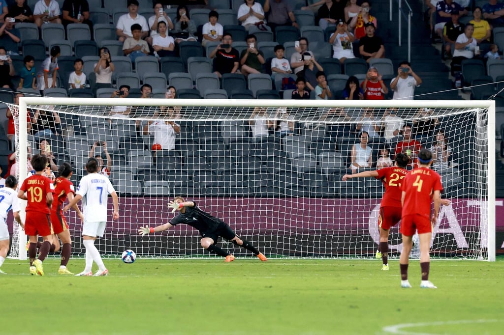 Shao Ziqin (second right) scores from the penalty spot for China's first goal in their 3-0 win. Photo: AFP