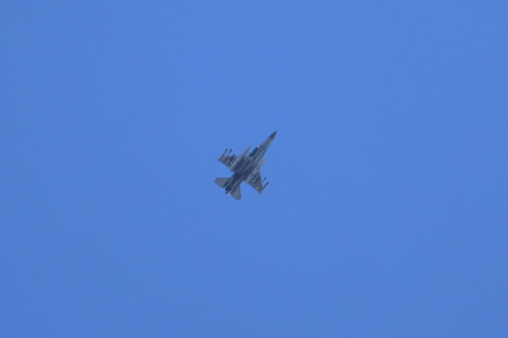 An Israeli fighter jet flies over southern Lebanon on Thursday, as seen from the border town of Metula in northern Israel. Photo: EPA