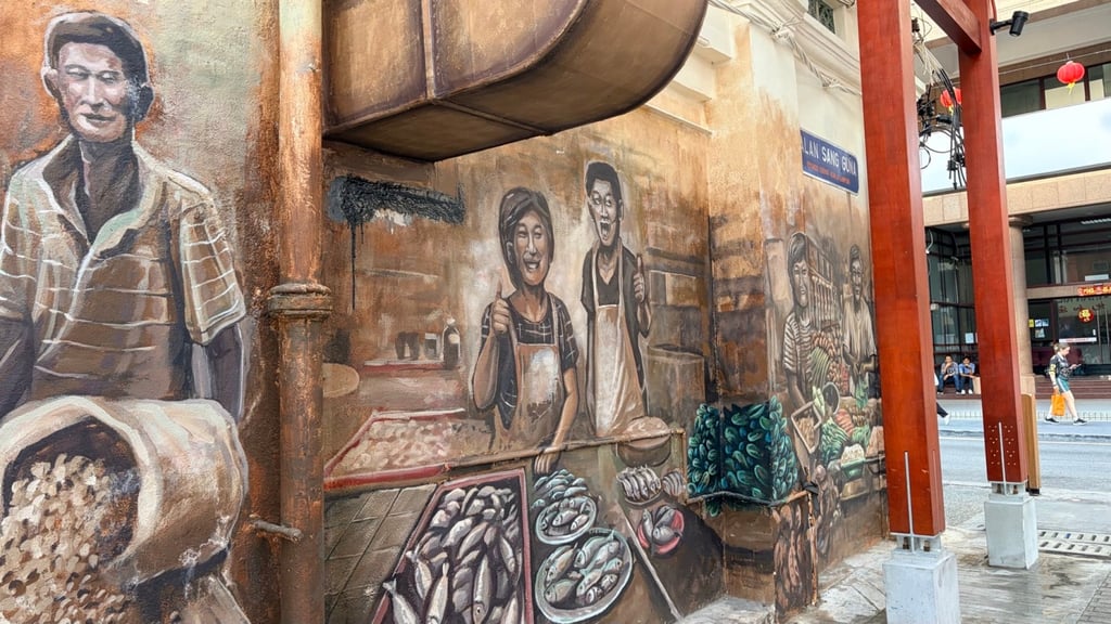 Murals painted around the entrance to Jalan Sang Guna. Photo: Ushar Daniele