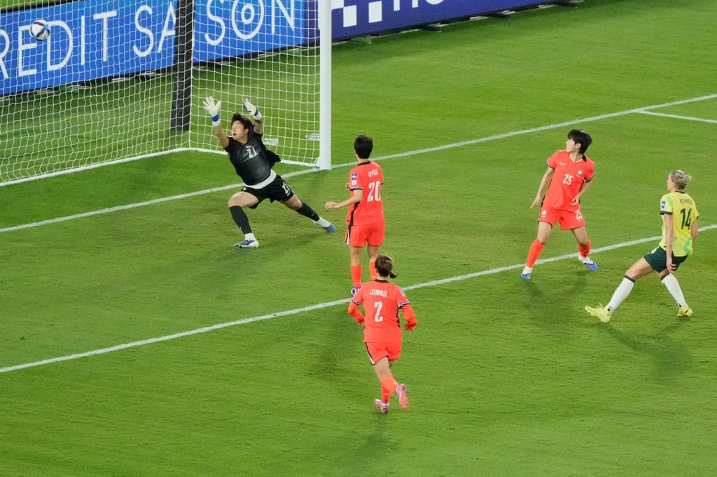 Alanna Kennedy (right) shoots past South Korean keeper Kim Min-jung to make it 3-3. Photo: AP