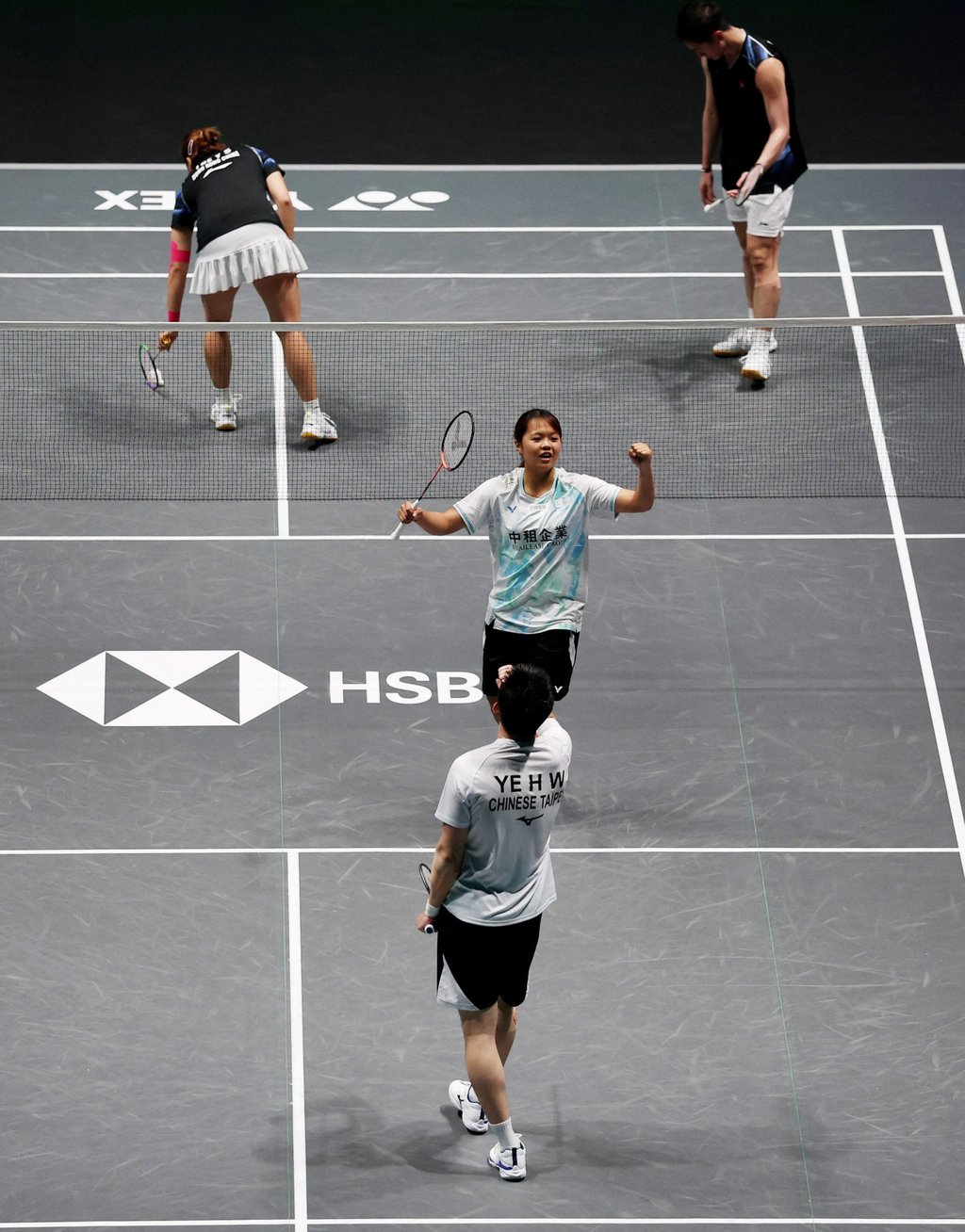 Chinese Taipei players Ye Hong Wei and Nicole Gonzales Chan (front) celebrate their victory. Photo: Reuters