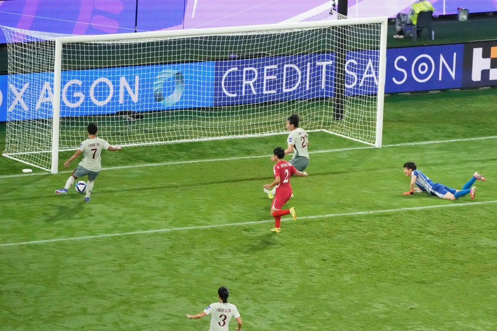 Wang Shuang (left) scores the winning goal for China. Photo: AP