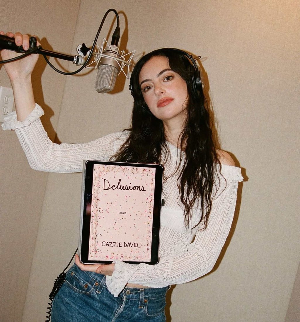 Cazzie David recording the audiobook of Delusions. Photo: @macmillan.audio/Instagram