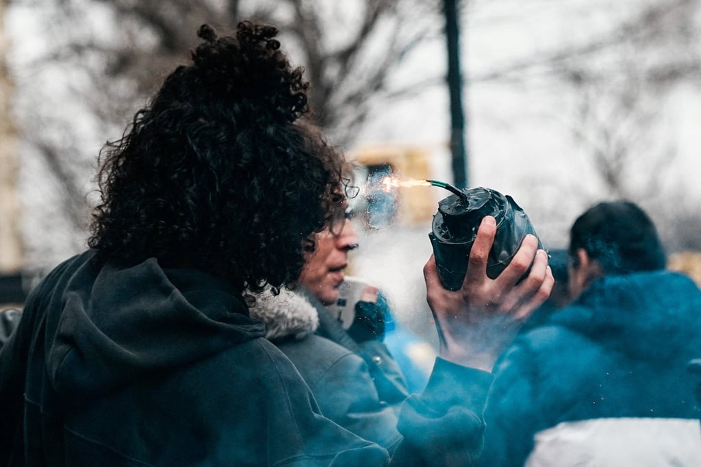 A man holds a home-made explosive in New York City on Saturday. Photo: Reuters