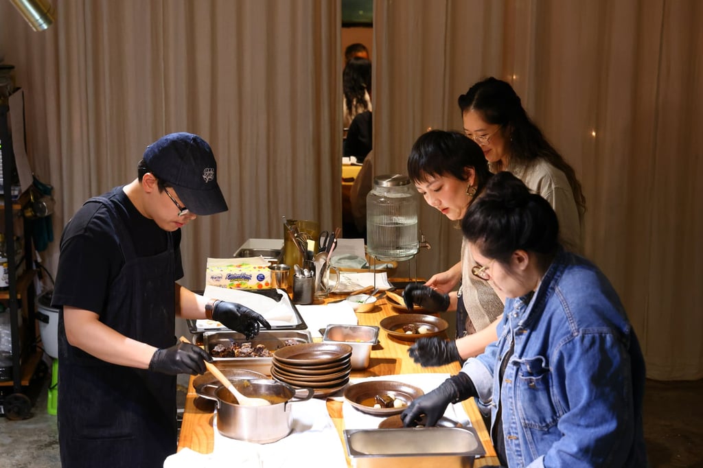 Food designer Alison Tan (right, without glasses) prepares food at “An Evening with Butter”, a literary dinner co-hosted by Gentle Books. Photo: Dickson Lee