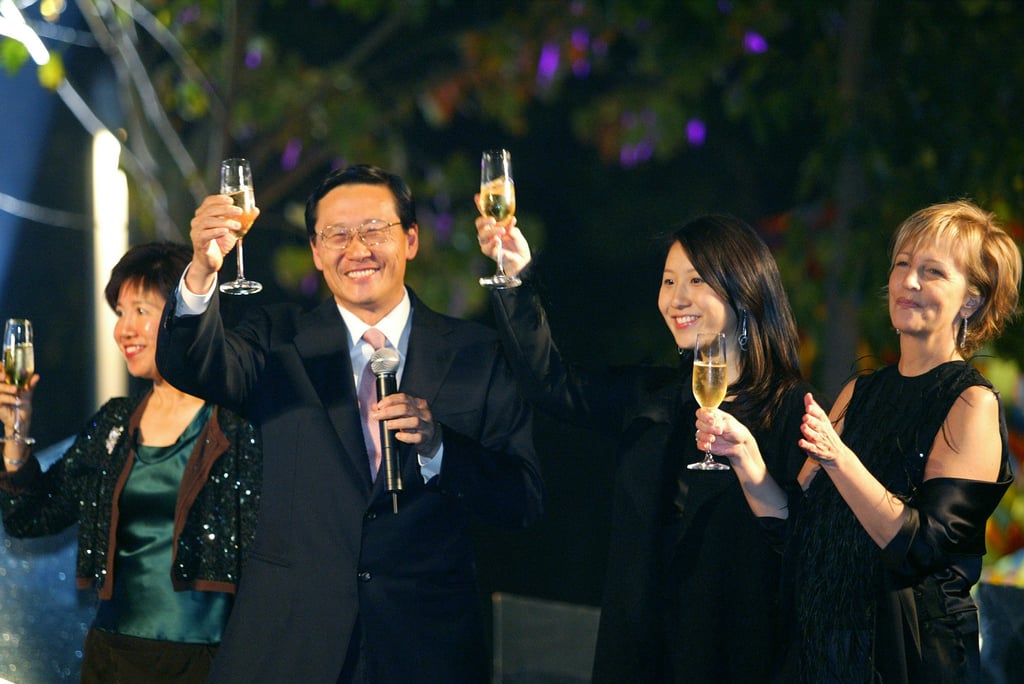 Bessie Pao-Woo and Peter Woo with daughter Jennifer, and Bonnie Brooks, president of The Lane Crawford Joyce Group, in 2004. Photo: SCMP Archives