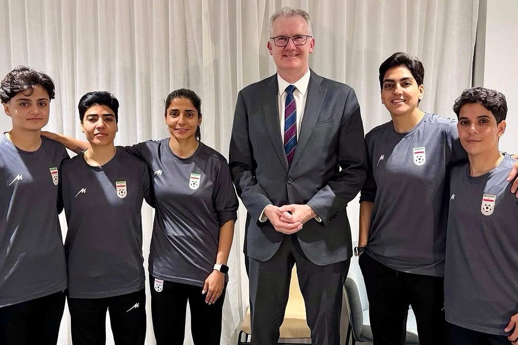Australia’s Home Affairs Minister Tony Burke with five Iranian players who were given asylum. Photo: Australian Department of Home Affairs via AFP