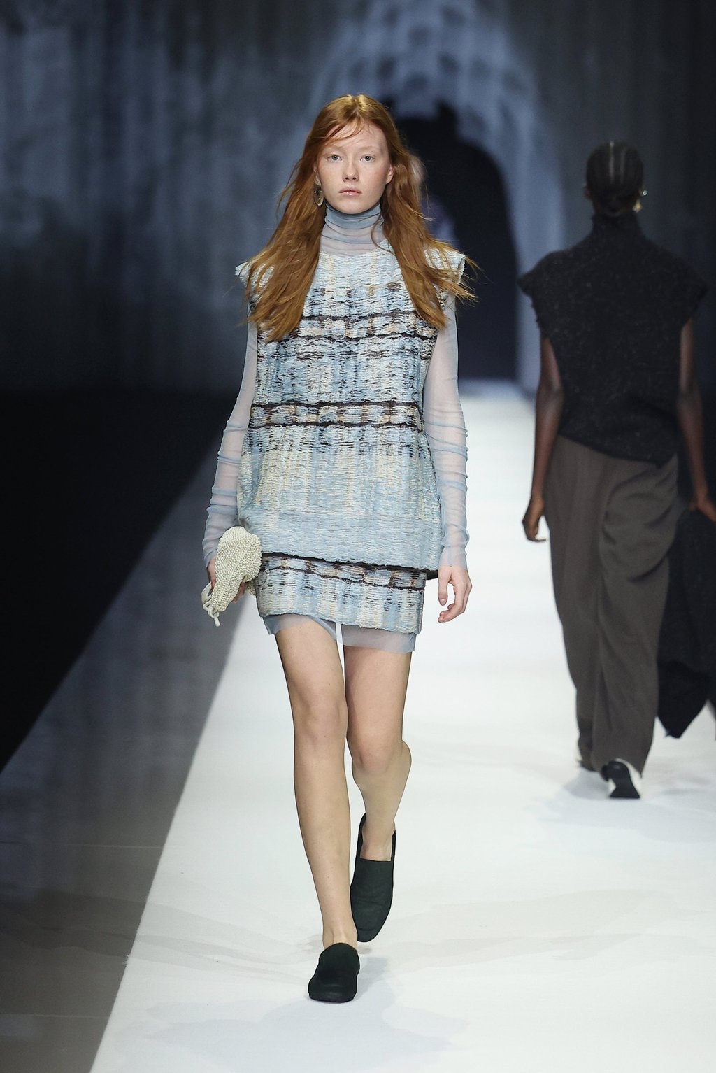 A reversed jacquard knit in misty blue exposes its inner structures on the runway, celebrating the raw beauty Aiko Miyanaga’s collaboration with Anteprima draws to the surface. Photo: Getty Images