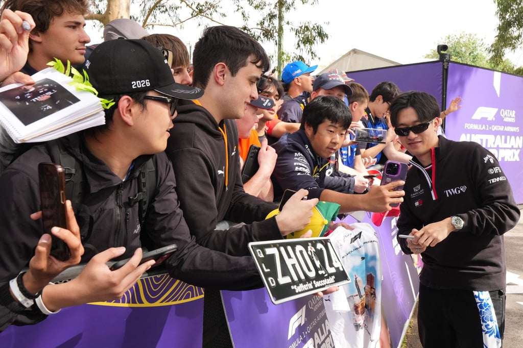 Cadillac reserve driver Zhou Guanyu meets fans at an Australian Grand Prix practice session. Photo: AP Cadillac reserve driver Zhou Guanyu meets fans at an Australian Grand Prix practice session. Photo: AP