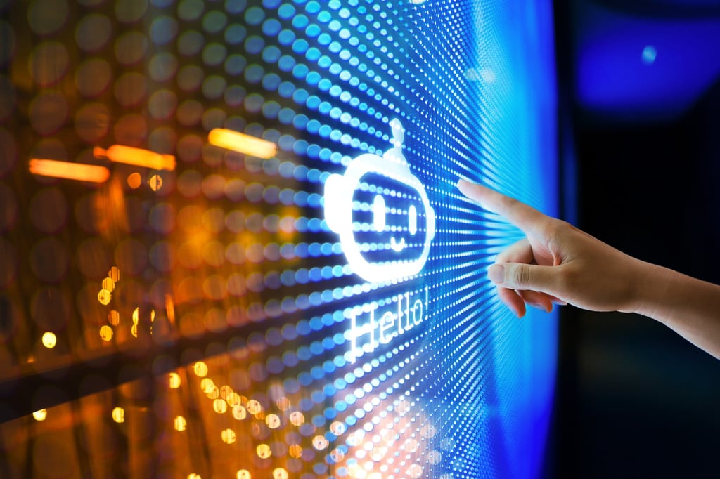 A young woman interacts with ChatGPT artificial intelligence chatbot technology on a digital screen. Photo: Getty Images