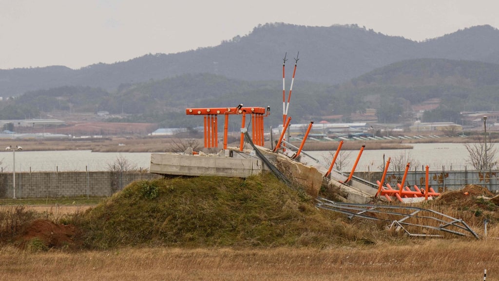 A damaged structure is seen at the end of the runway at Muan International Airport on December 14, 2024, after Jeju Air’s Flight 2216 crashed. Photo: AFP