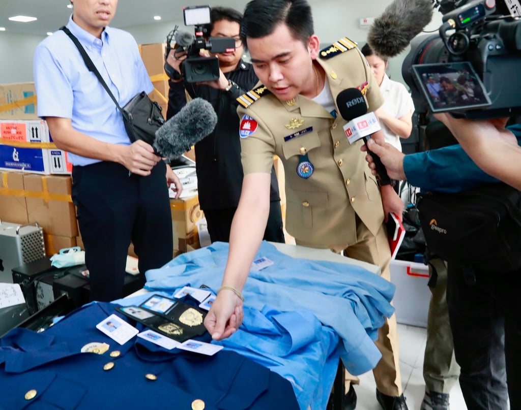 Cambodian authorities display equipment seized from a scam centre in Phnom Penh on Wednesday. Photo: EPA
