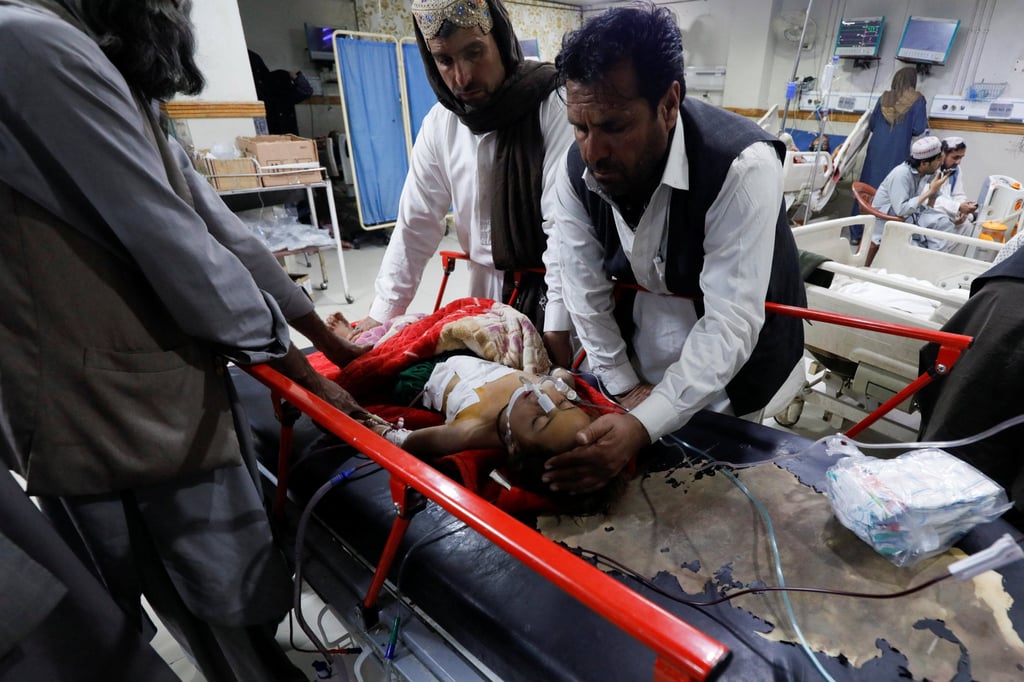 Eleven-year-old Amna, who was injured during what locals say was a possible drone strike on a residential house in the Sarah Gharghai area, receives medical aid in the Civil Hospital in Quetta, Pakistan, on Friday. Photo: Reuters