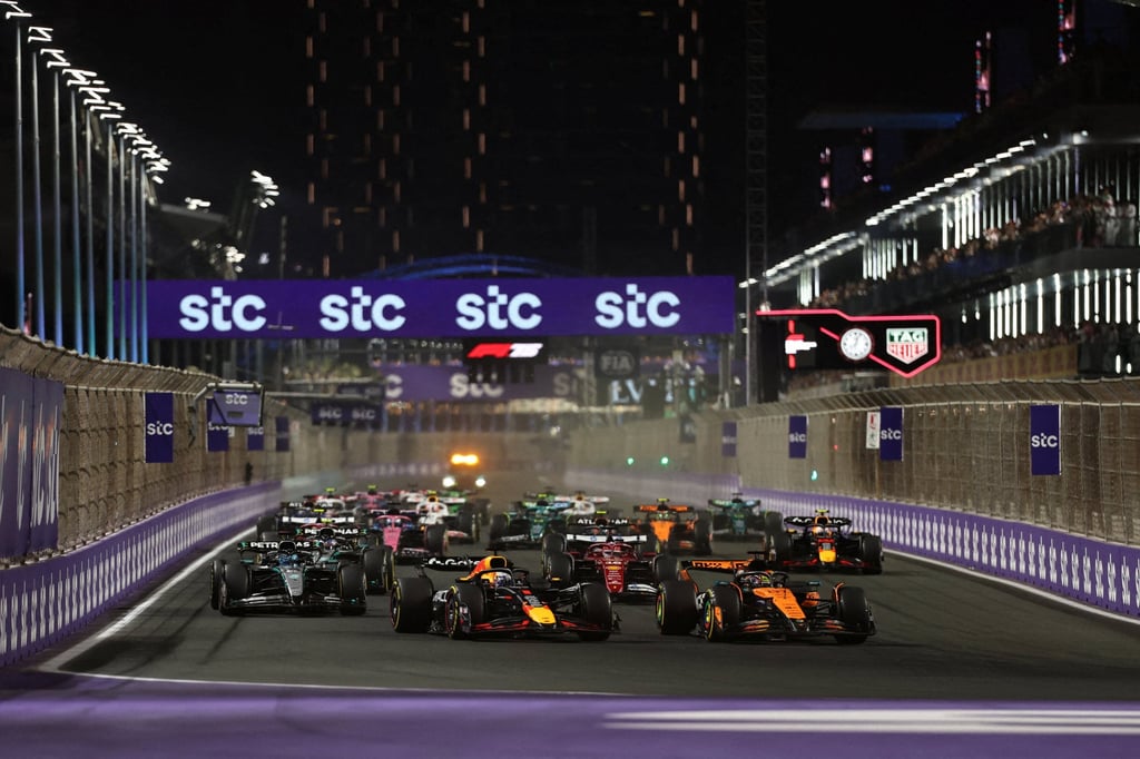 Red Bull’s Max Verstappen and McLaren’s Oscar Piastri lead into the first corner at the start of the 2025 Saudi Arabian Grand Prix in Jeddah. Photo: Reuters