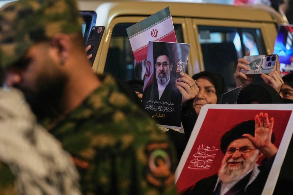 Shia Muslims wave Iranian flags and hold portraits of late supreme leader Ayatollah Ali Khamenei and his son, Mojtaba Khamenei, during the annual Jerusalem Day march in Baghdad on Friday. Photo: AP Shia Muslims wave Iranian flags and hold portraits of late supreme leader Ayatollah Ali Khamenei and his son, Mojtaba Khamenei, during the annual Jerusalem Day march in Baghdad on Friday. Photo: AP