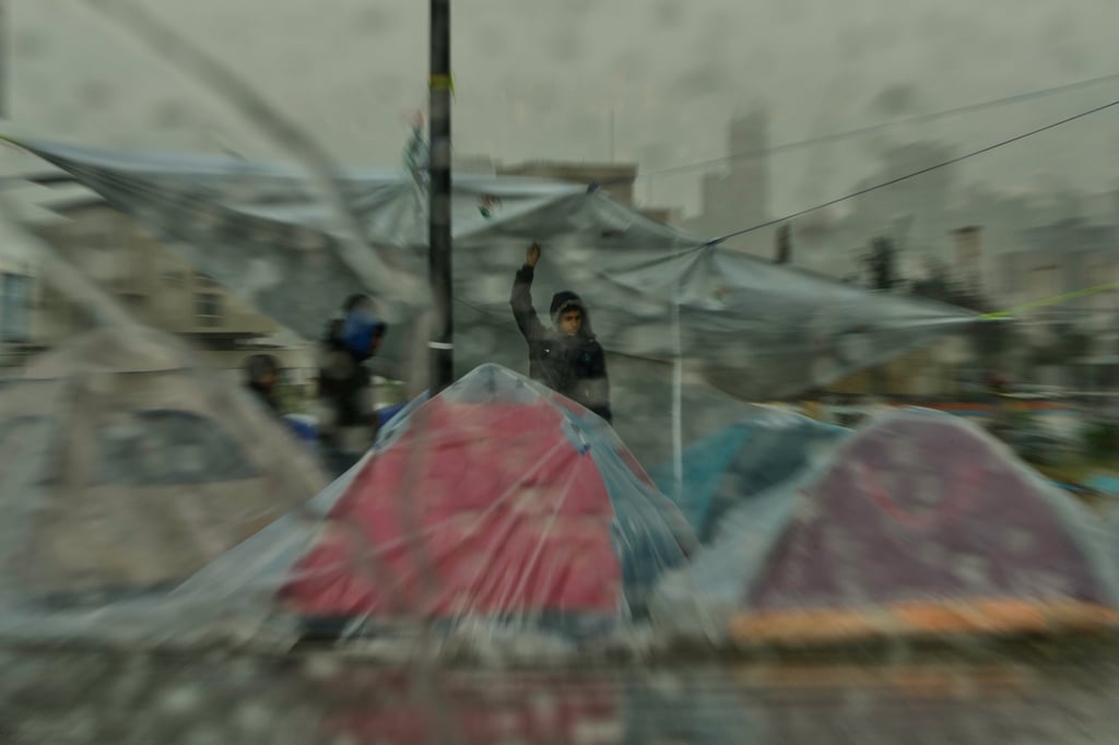 Heavy rain falls over tents sheltering people displaced by Israeli airstrikes in Lebanon on Sunday. Photo: AP