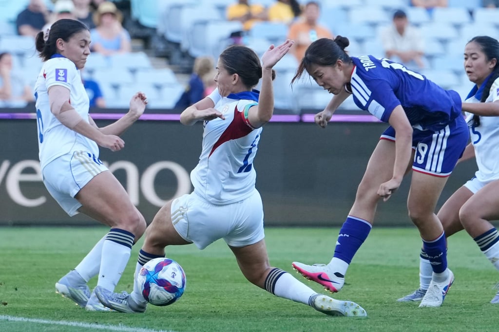 Momoko Tanikawa (right) scores Japan’s sixth goal against the Philippines on Sunday. Photo: AP