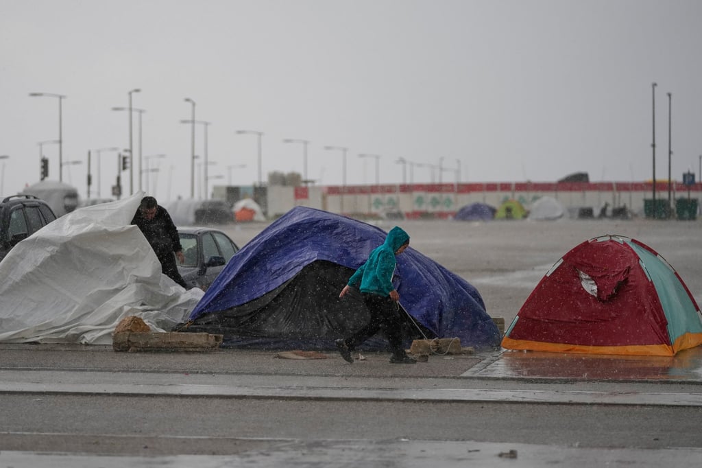 Heavy rain falls over tents sheltering people displaced by Israeli air strikes in Lebanon. Photo: AP Heavy rain falls over tents sheltering people displaced by Israeli air strikes in Lebanon. Photo: AP