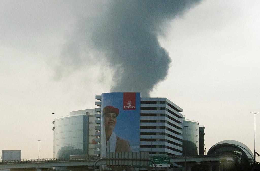 Smoke rising from an area near the Dubai International Airport. Photo: Reuters