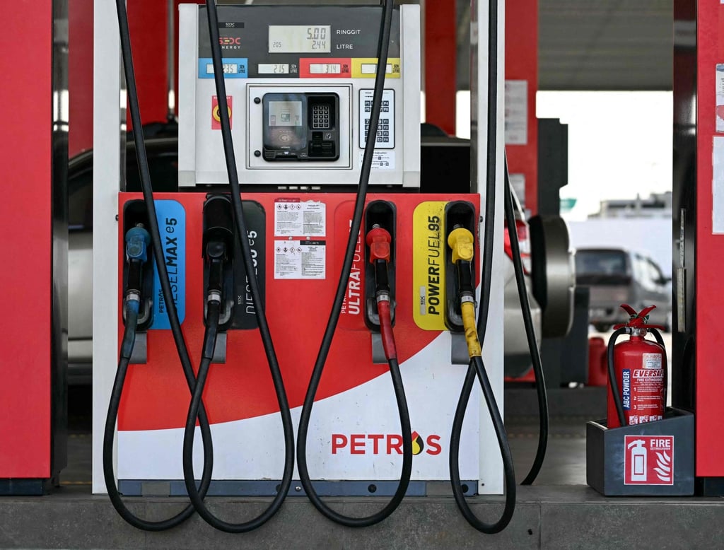 Fuel pump nozzles are pictured at a Petros station in Kuching. Photo: AFP Fuel pump nozzles are pictured at a Petros station in Kuching. Photo: AFP