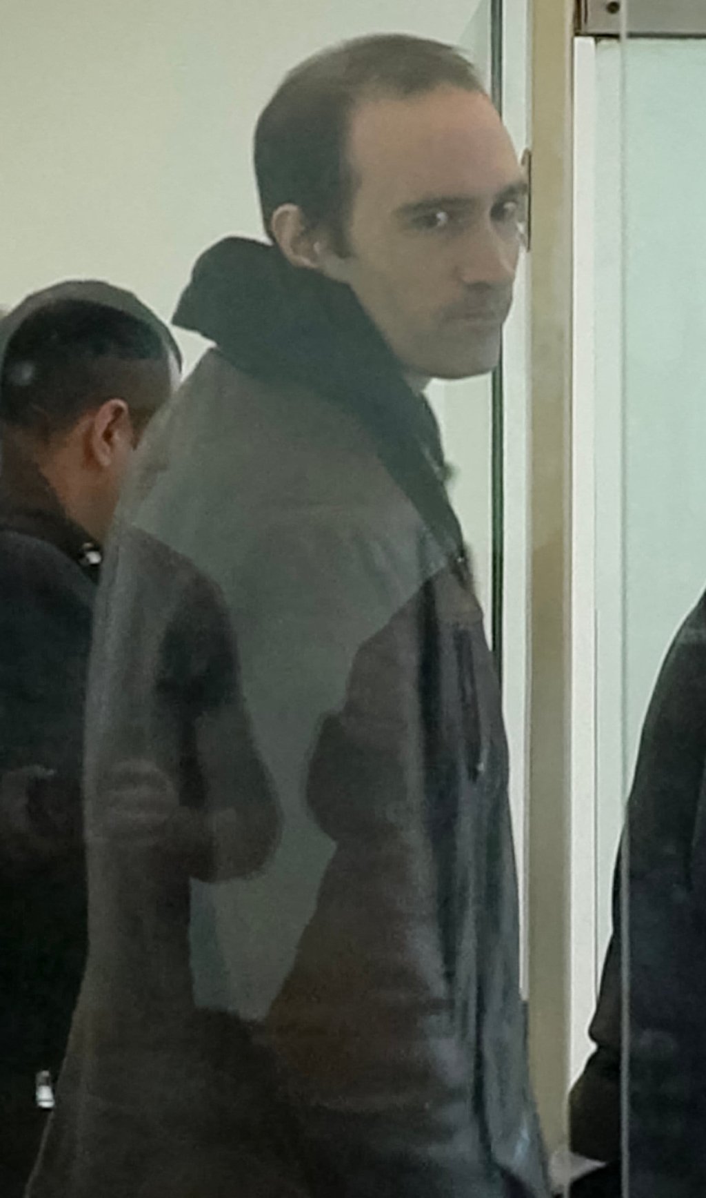 Martin Ryan glances at photographers during his trial on spy charges in Baku on January 6,. Photo: AFP